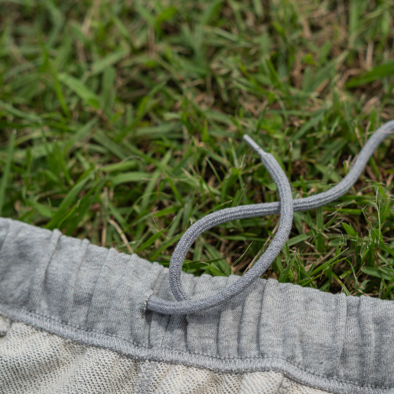 ARAKA LAYERED PATCH SWEATPANTS