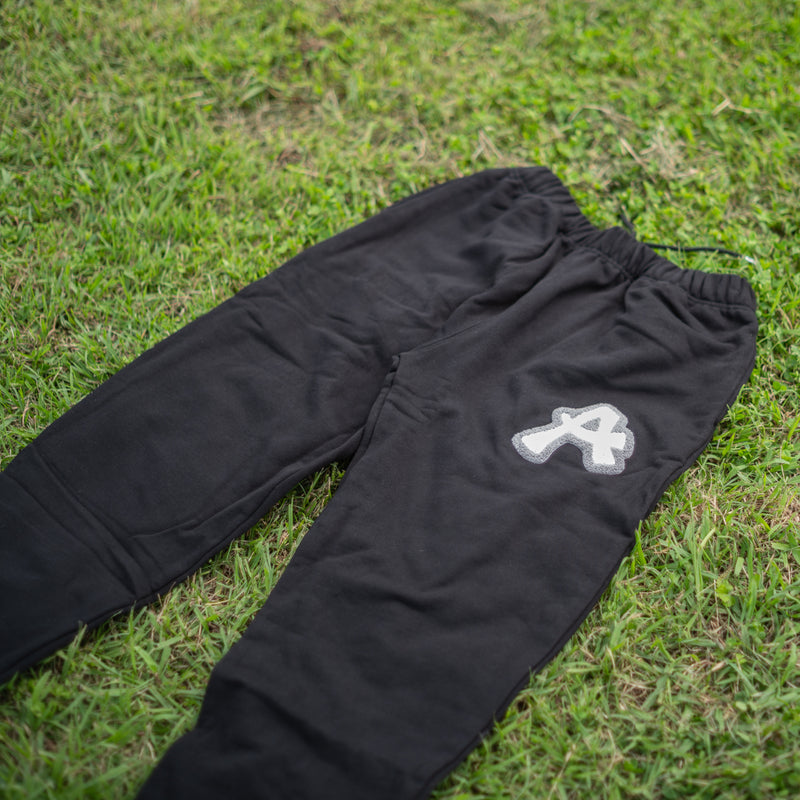 ARAKA LAYERED PATCH SWEATPANTS