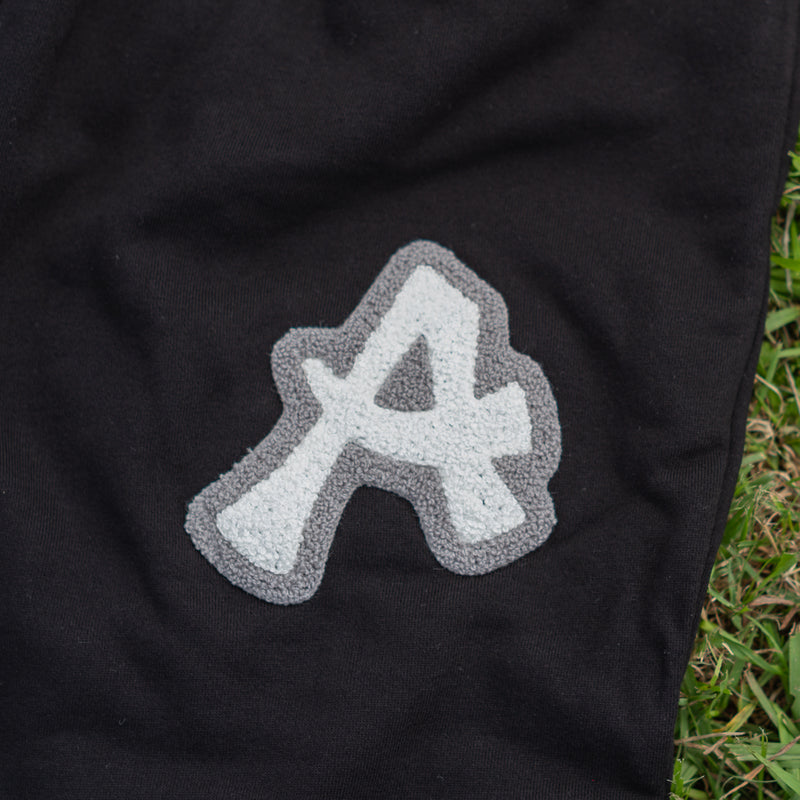 ARAKA LAYERED PATCH SWEATPANTS