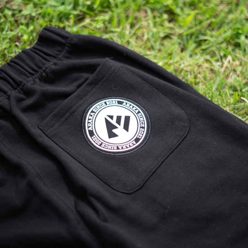 ARAKA LAYERED PATCH SWEATPANTS