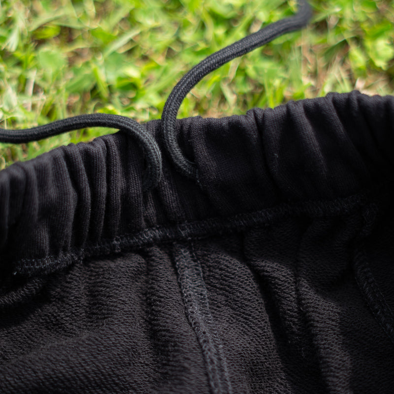 ARAKA LAYERED PATCH SWEATPANTS