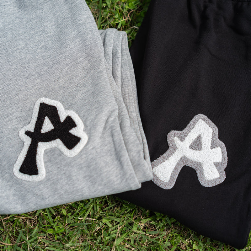 ARAKA LAYERED PATCH SWEATPANTS