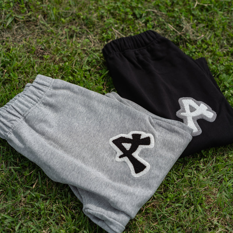 ARAKA LAYERED PATCH SWEATPANTS