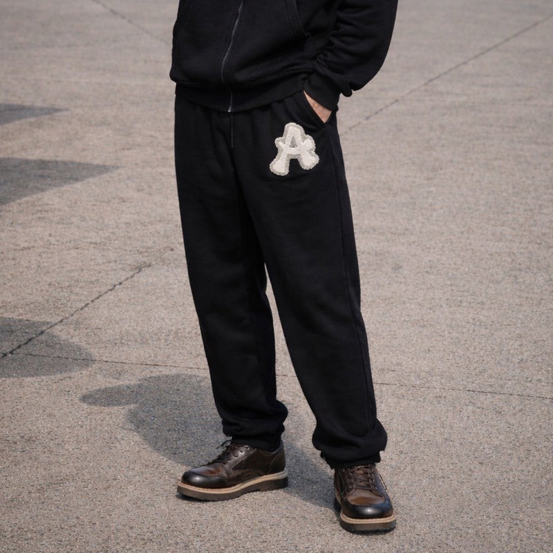 ARAKA LAYERED PATCH SWEATPANTS